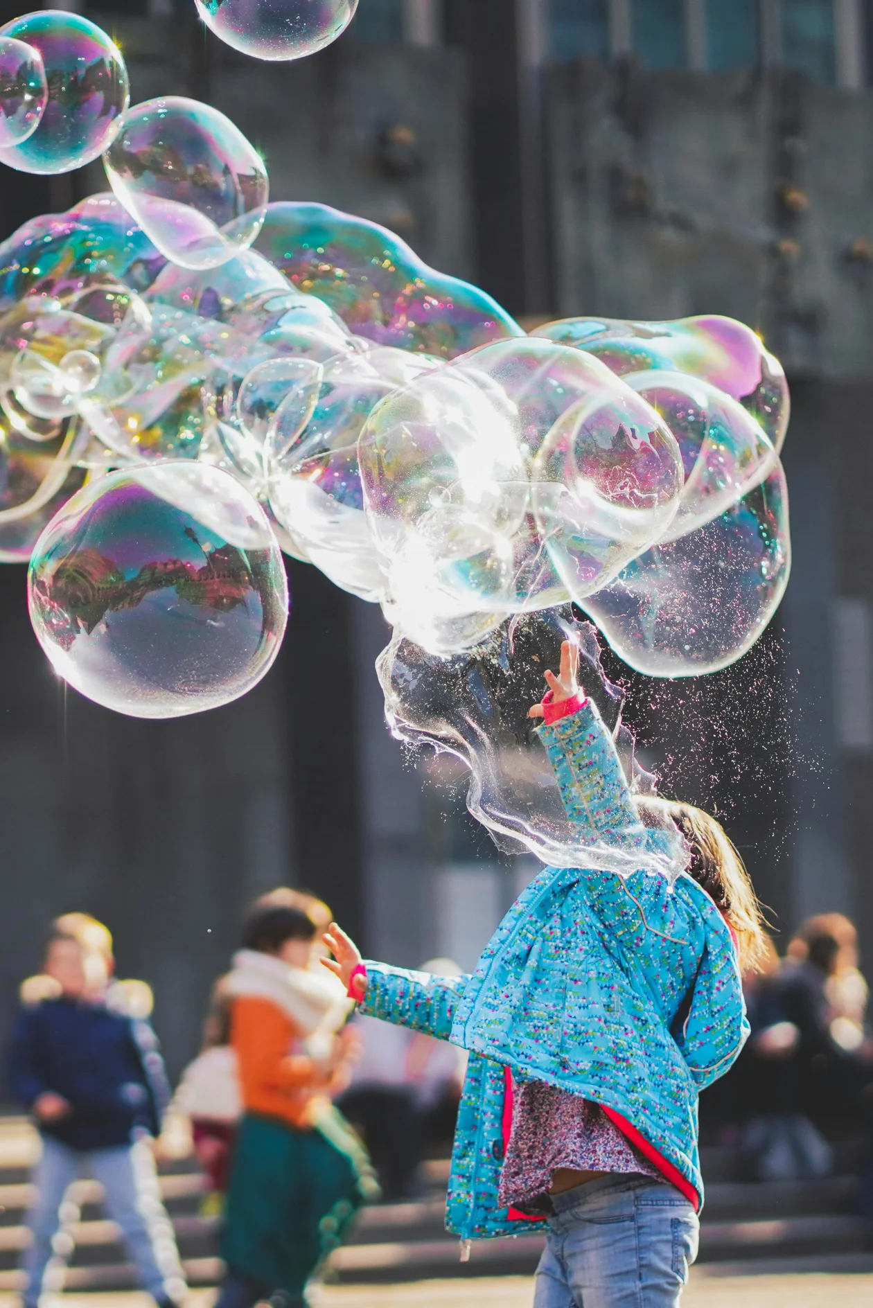 kids playing with bubbles